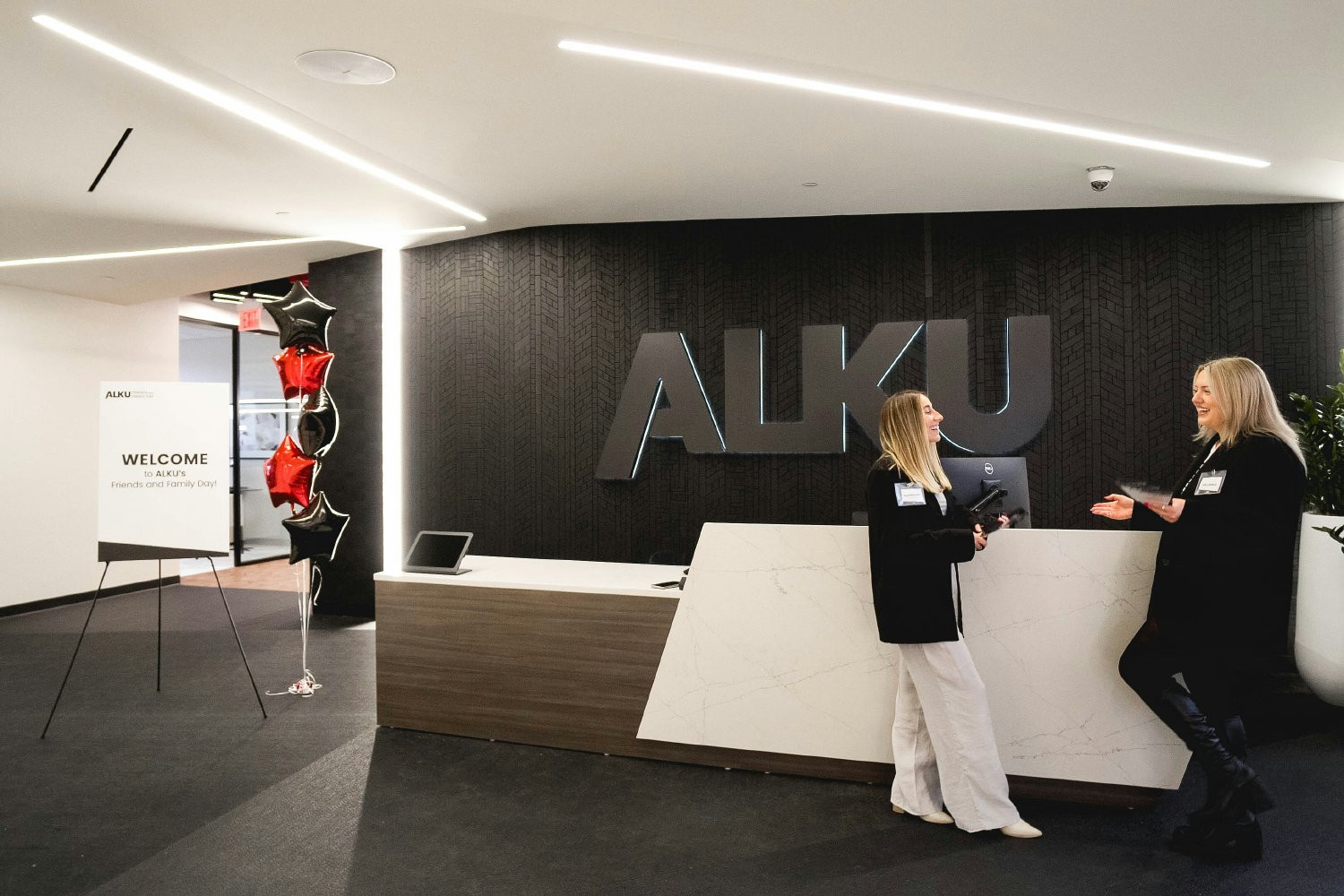ALKU's front desk in the Andover Headquarters welcomes visitors as soon as they enter the office. 