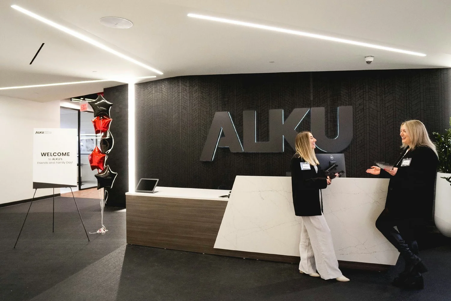 ALKU's front desk in the Andover Headquarters welcomes visitors as soon as they enter the office. 
