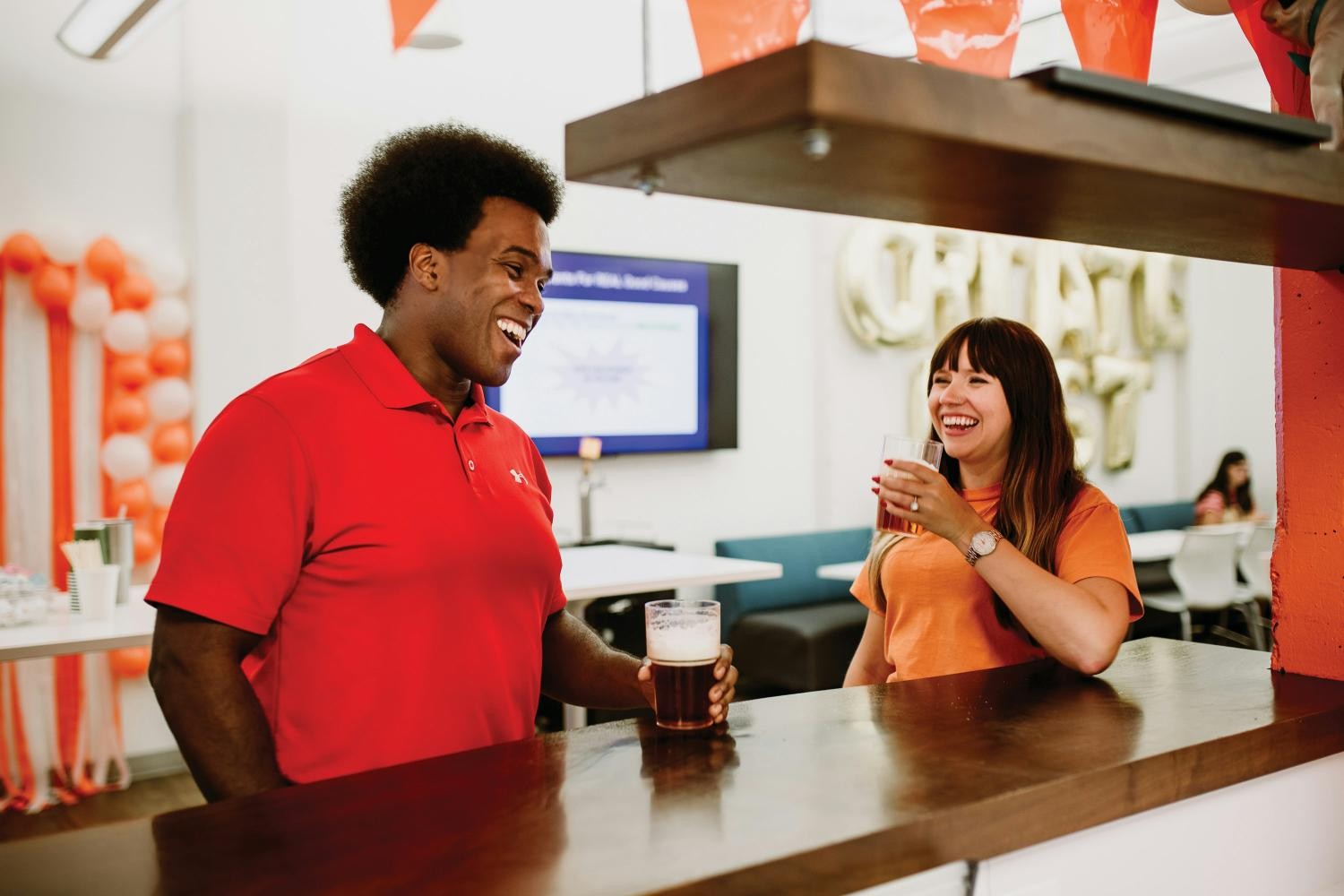 Two Eventbrite employees chat in Eventbrite's office located in Nashville.