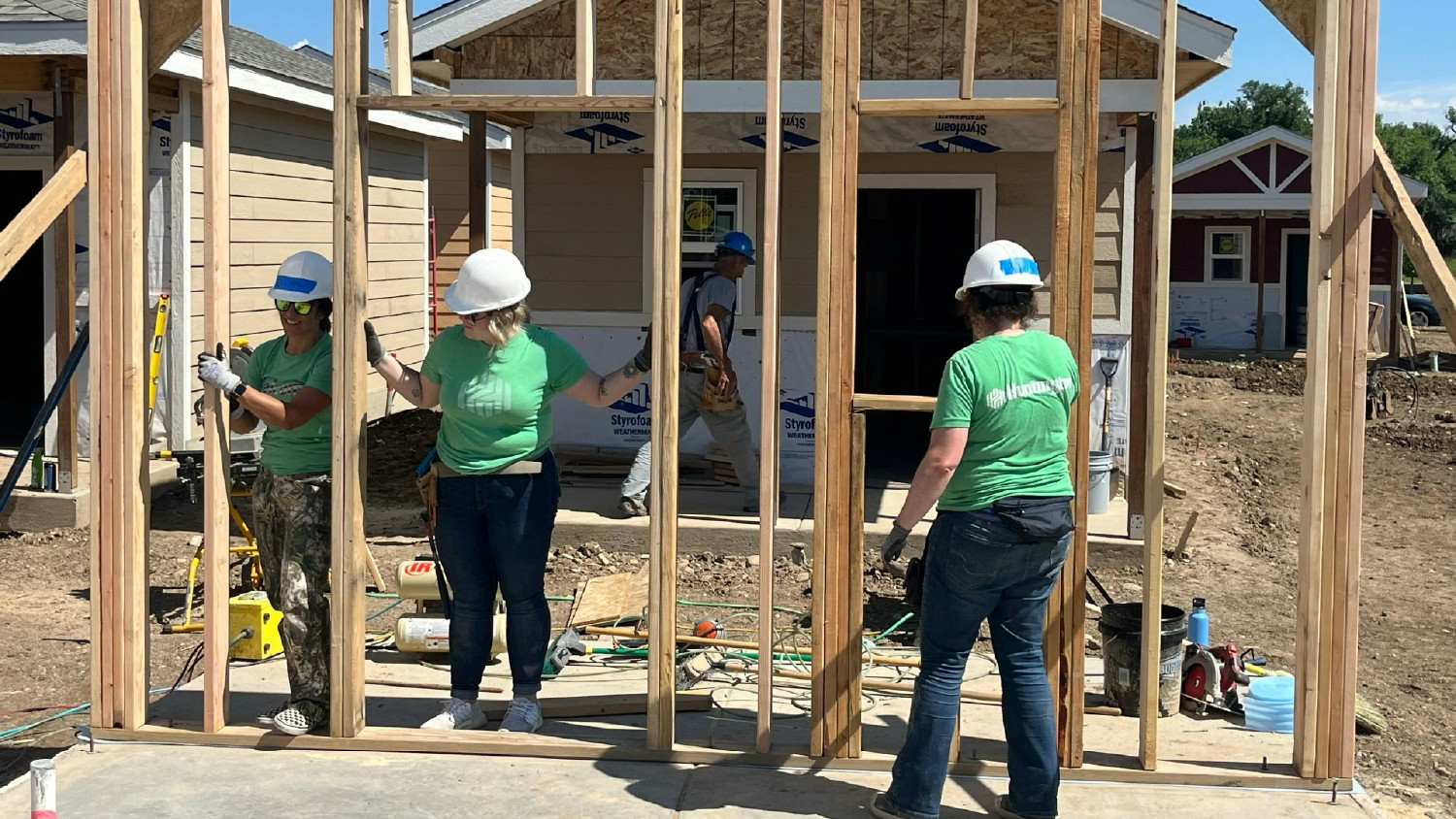 Colleagues from the Military Business Resource Group building houses to end veteran homelessness in Longmont, CO. 

