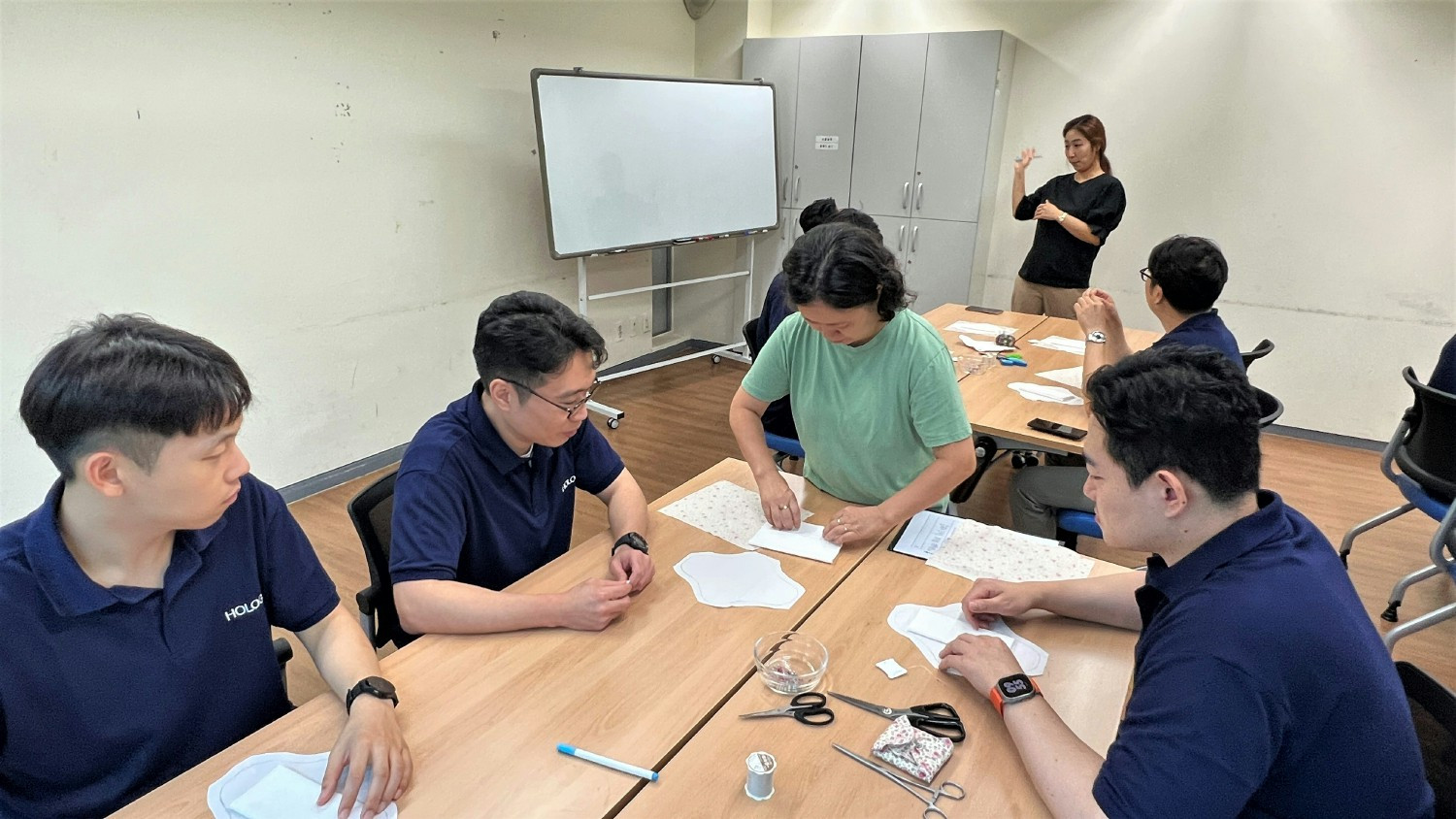 Hologic team members volunteer in making reusable cloth sanitary napkins that are donated to women in need in Korea.