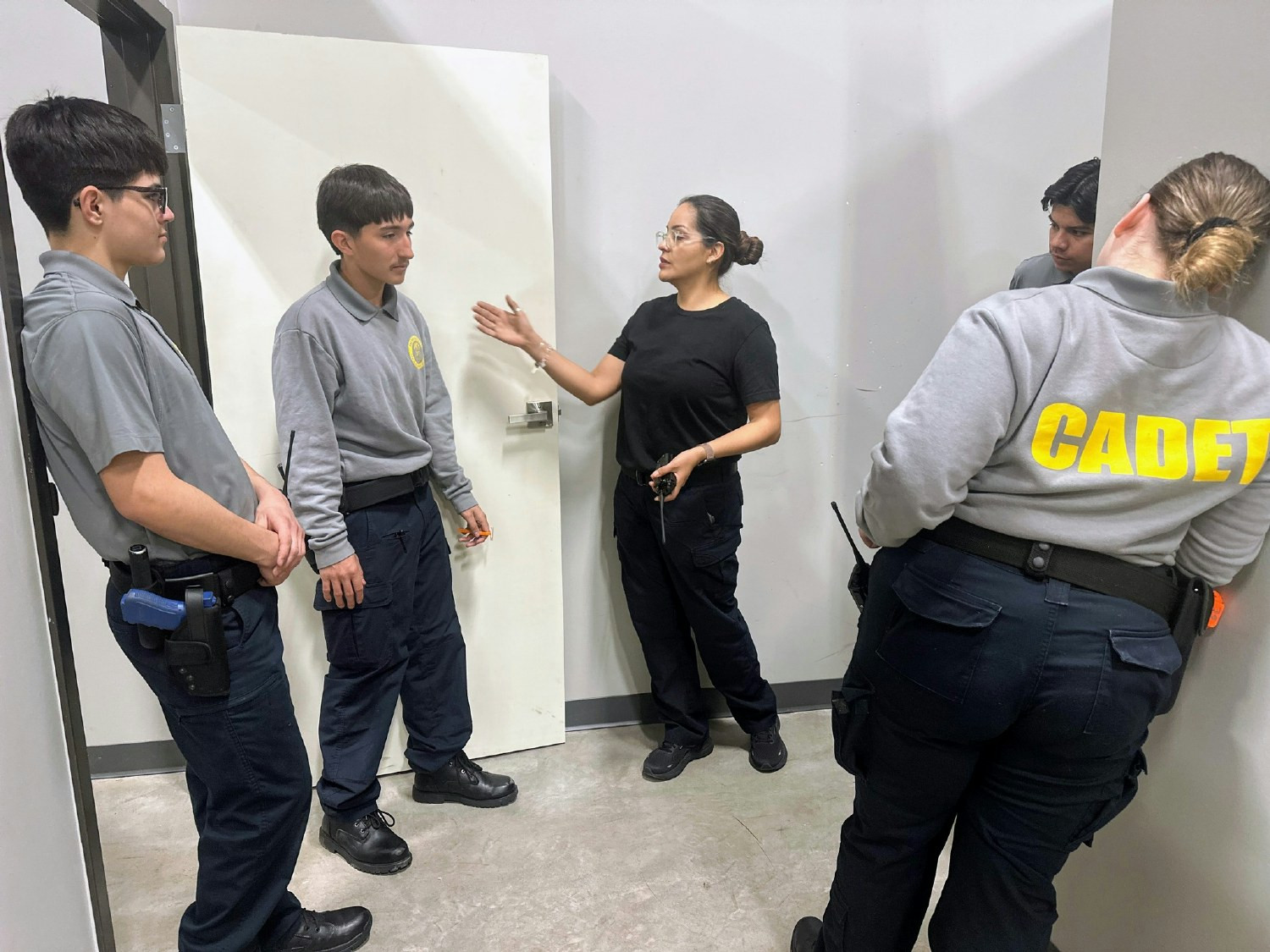 Law Enforcement instructor teaching students the proper techniques for evidence collection.