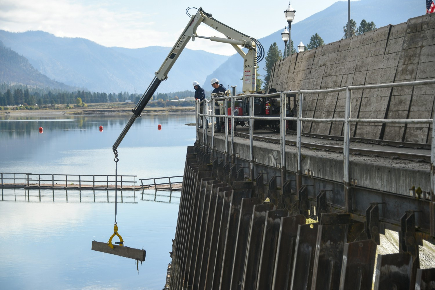 NorthWestern Energy hydro employees work to replace the flashboards on Thompson Falls Dam in northwest Montana.
