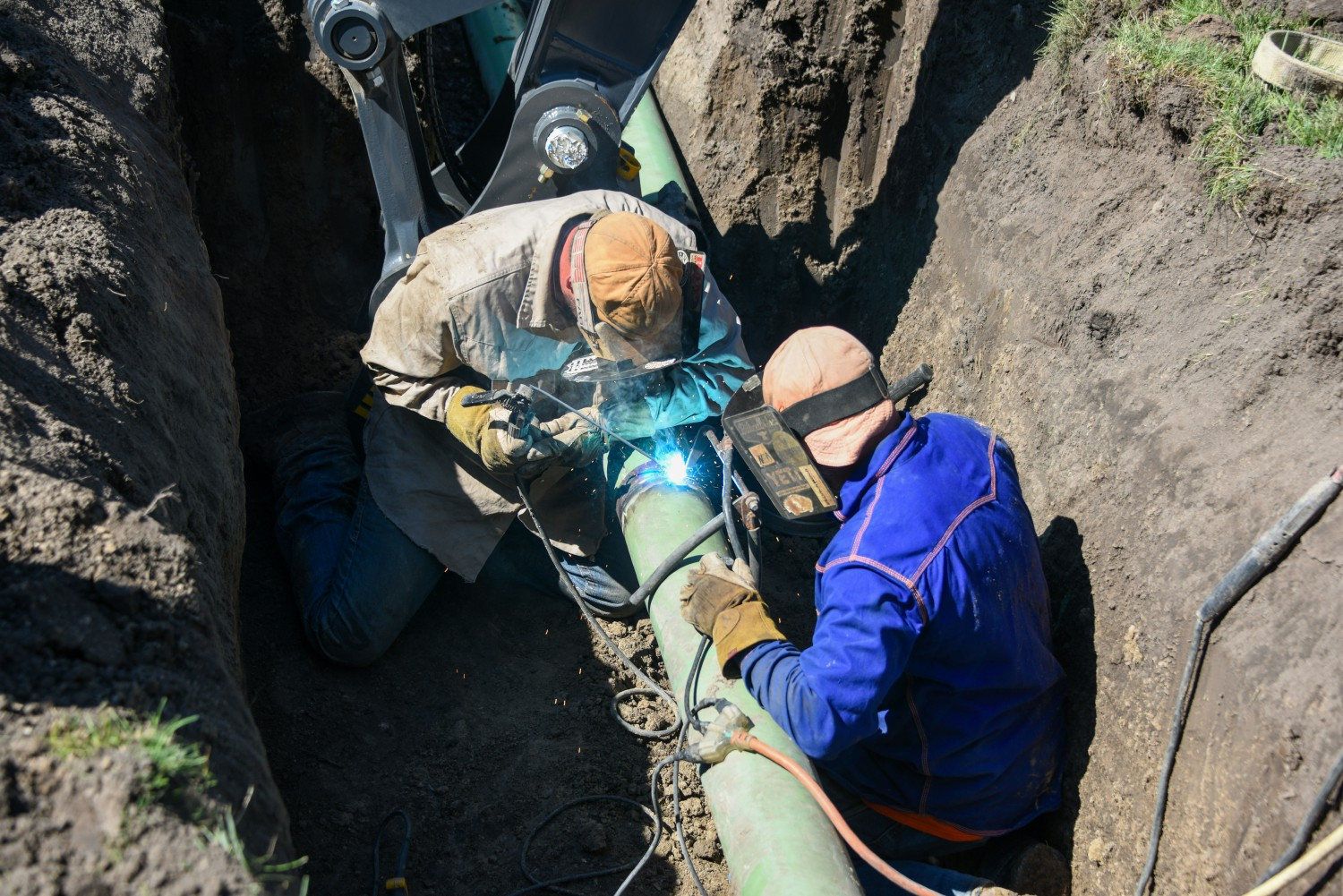 A gas crew in Grand Island, Nebraska, welds a new natural gas pipeline in place.