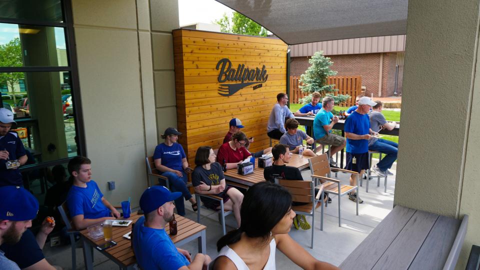 This is a group of employees enjoying a nice day out on the patio after being nominated as a Top 10 Small Business in Kansas City.