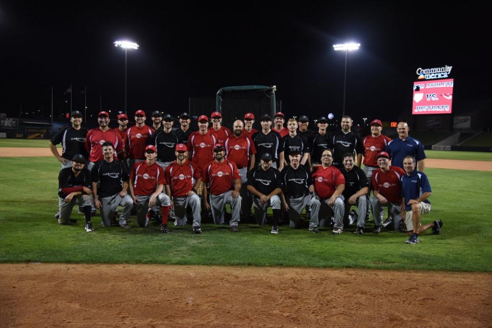 This is a group of employees after our company wide baseball game that is played at T-Bones Stadium, an independent minor league baseball team located in Kansas City. Proceeds go to benefit charities.