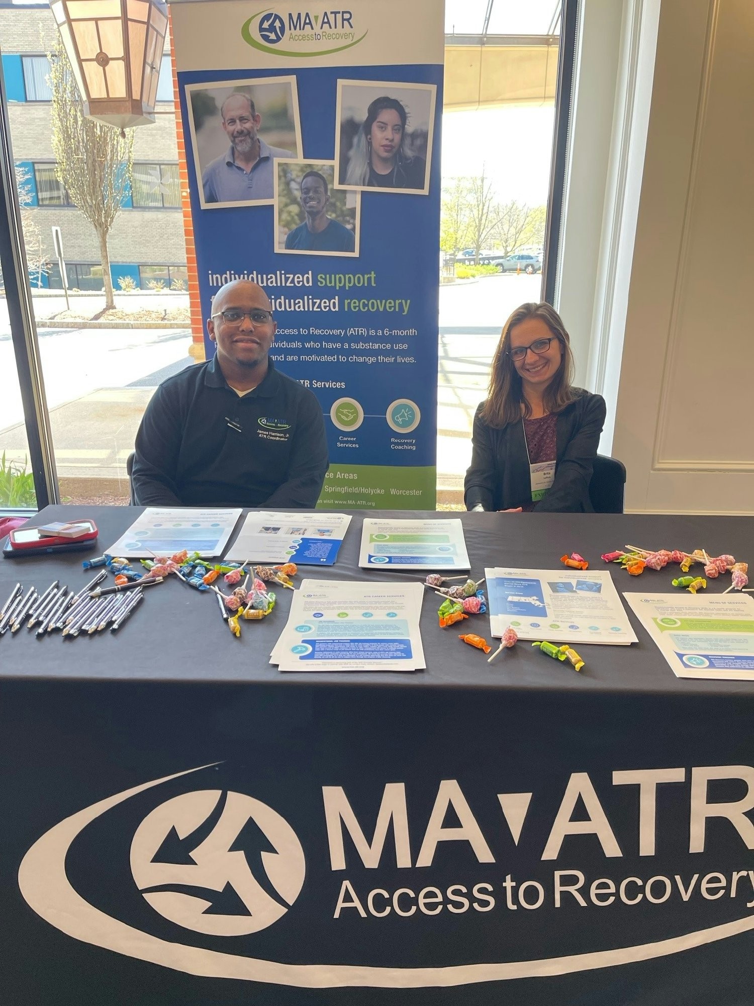Two members of our MA Access to Recovery team sharing information to attendees at a State Behavioral health conference.
