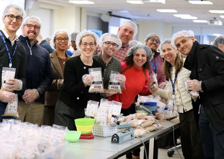 During Verisk's Annual Volunteer Week, colleagues gathered to pack over 86,000 meals for Rise Against Hunger.