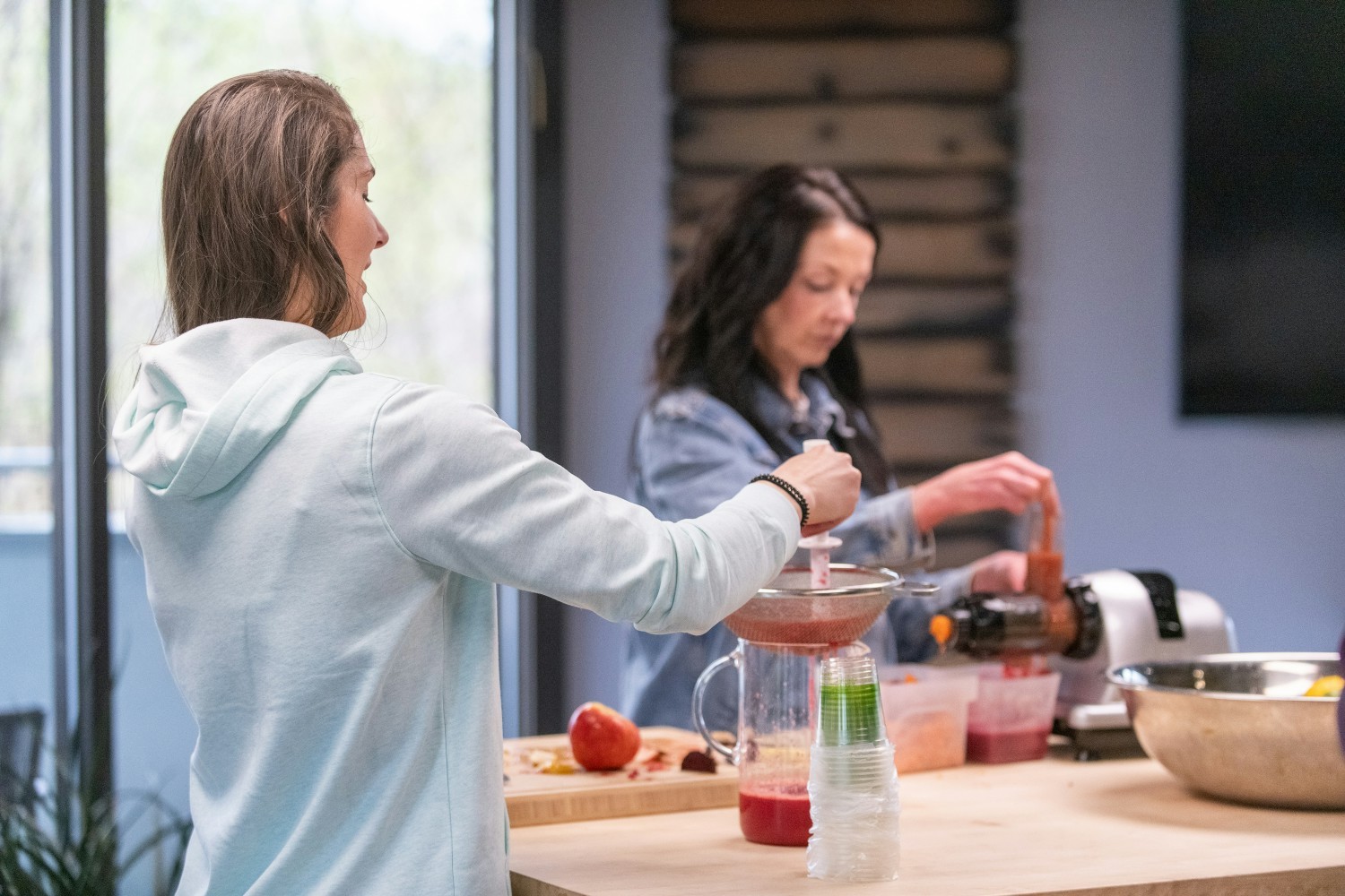 Our onsite nutritionist making juice with fruit from our onsite organic garden