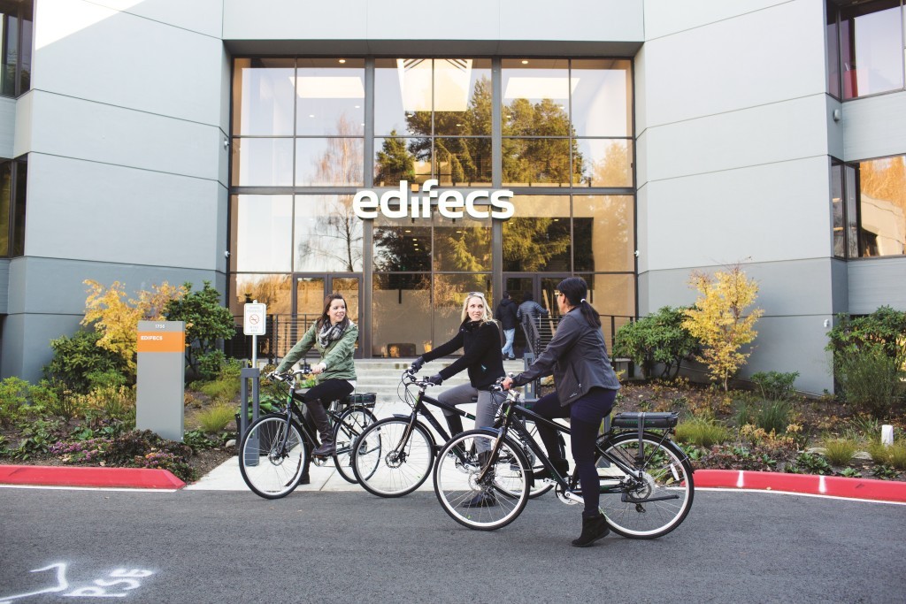 Our employees enjoying the electric bikes we offer free for their use
