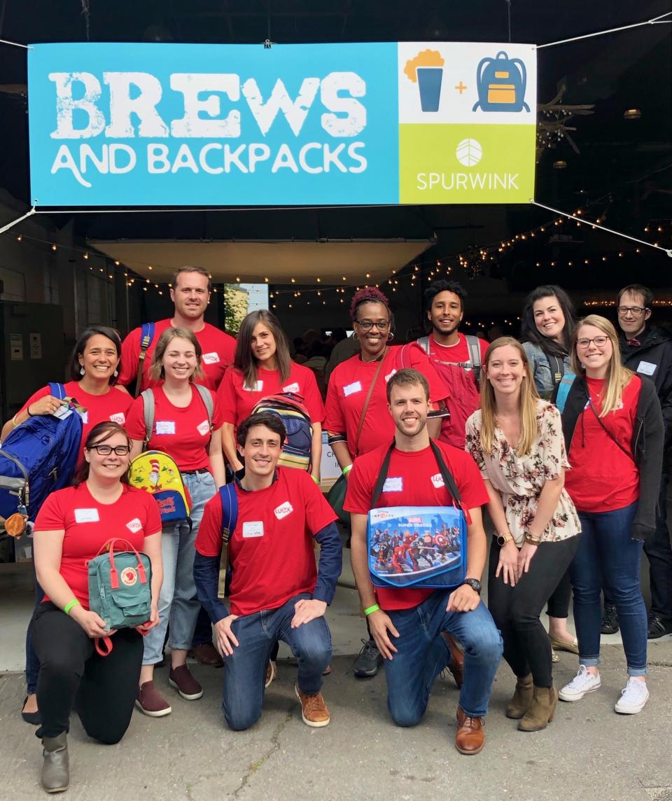 Members of one of WEX's Employee Resource Groups, NexGen, spent time at Spurwink's Brews and Backpacks event, where they prepared bags with toys, books, and toiletries for children in Spurwink's day, residential, foster care, child abuse, and refugee programs.