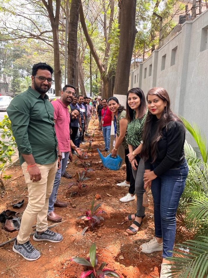 The Calix India team grows new plants in the community to give back on Earth Day