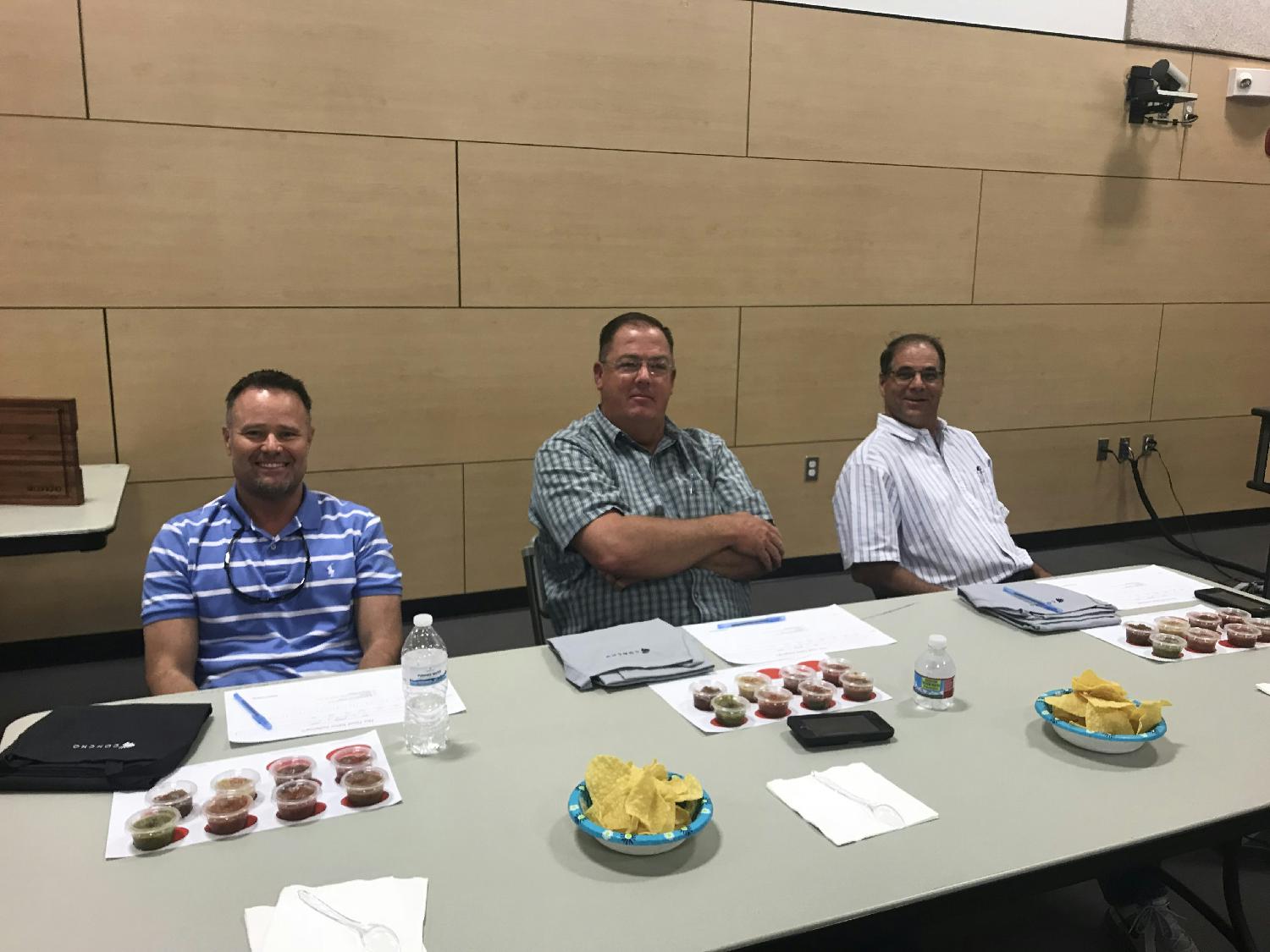 Employees judging salsa entries for annual salsa contest in our Artesia office
