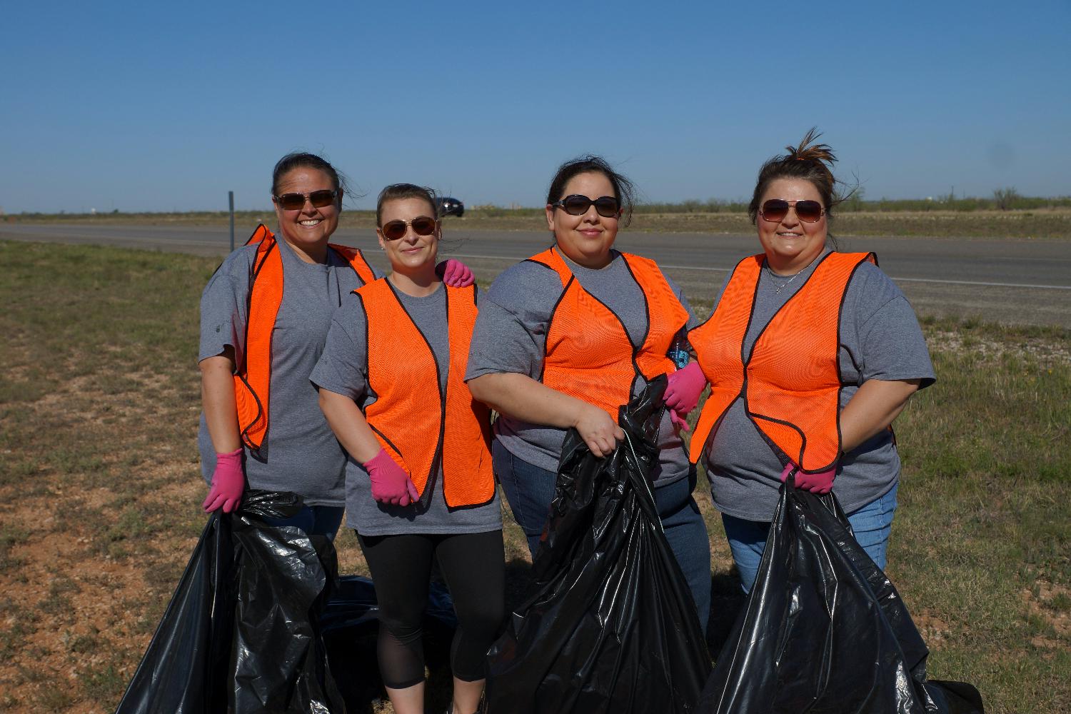 Employees participating in annual apPrentice project in partnership with Keep Midland Beautiful