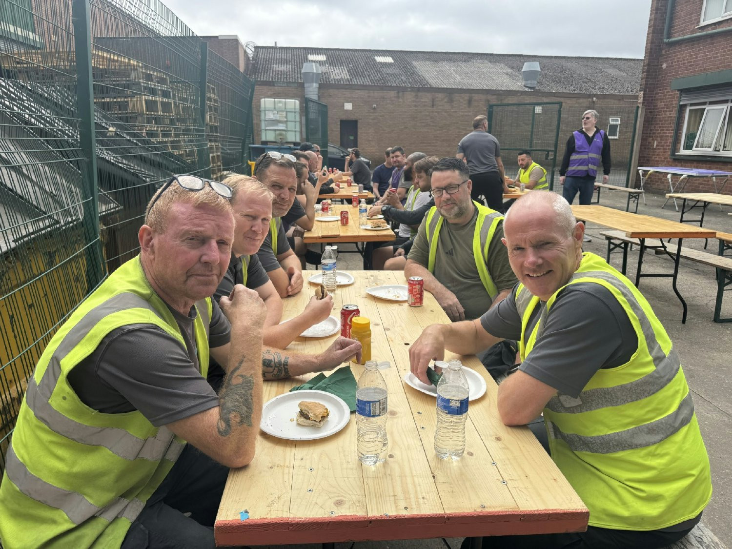 The United Kingdom team enjoying a meal together, at one of the biannual years of service events.