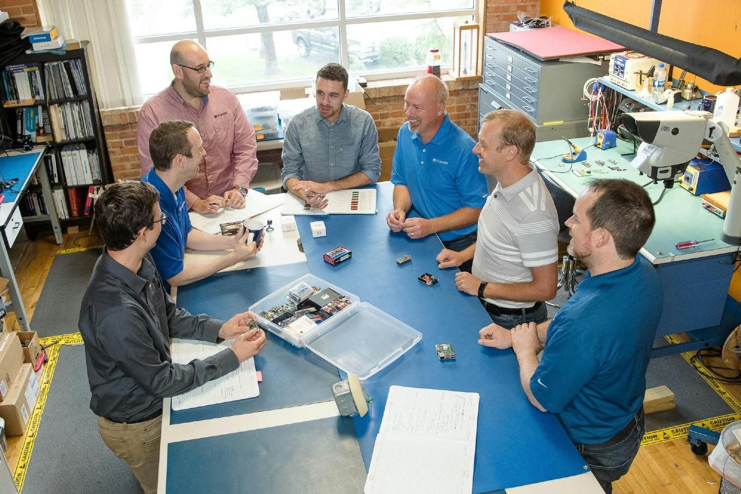 The Hardware and Software team meets together in the electronics lab