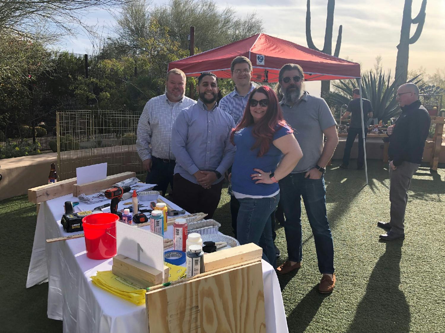 Our teams busy building dog houses for the Fetch foundation in Scottsdale, AZ at Sales Kick Off