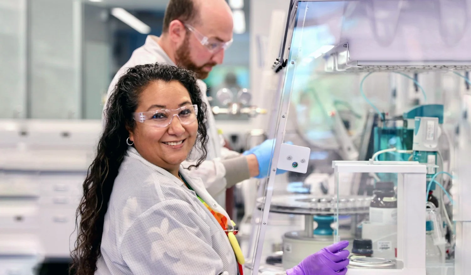 Alnylam employees working in the lab