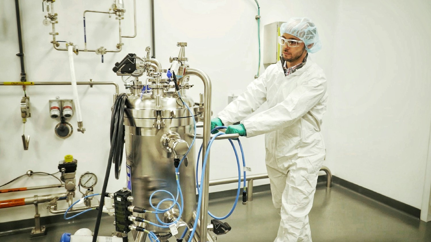 Alnylam employee working in the manufacturing facility.