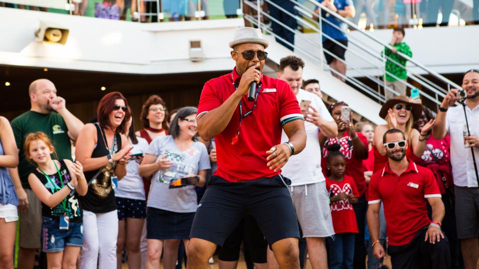 Cruise Director welcoming our guests during the deck party on the Carnival Magic.