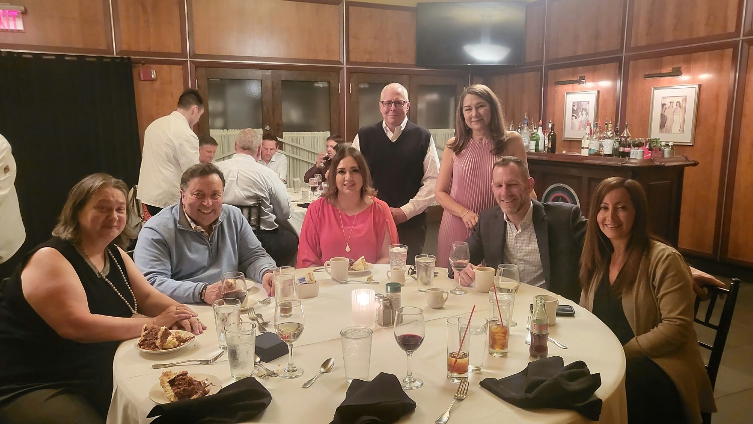 CEO Ron Friedman, President Vince Pinneri, and other Executive team leaders join a retirement celebration.