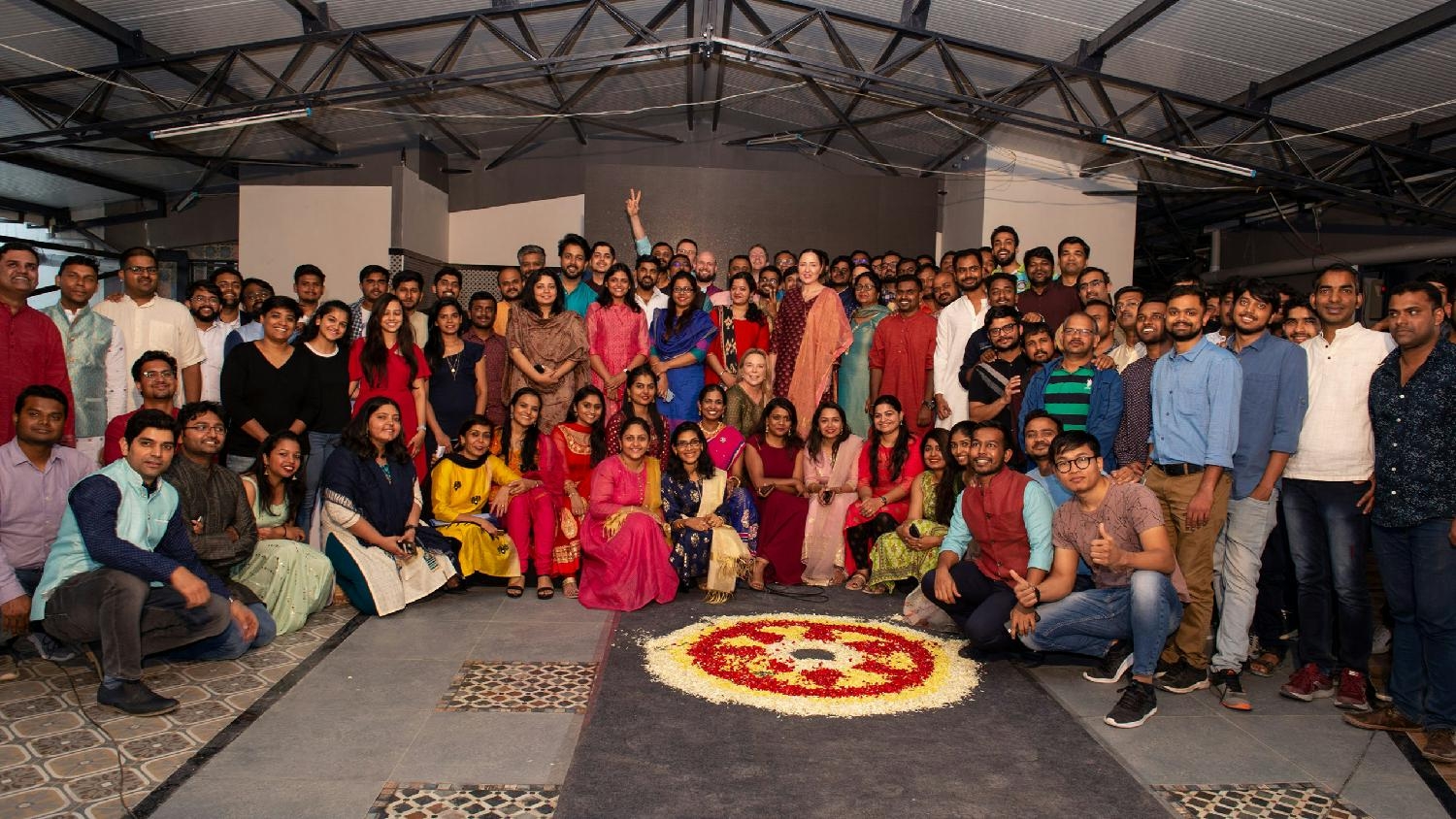 Employees in India, celebrating the opening of our new office in Bangalore. 