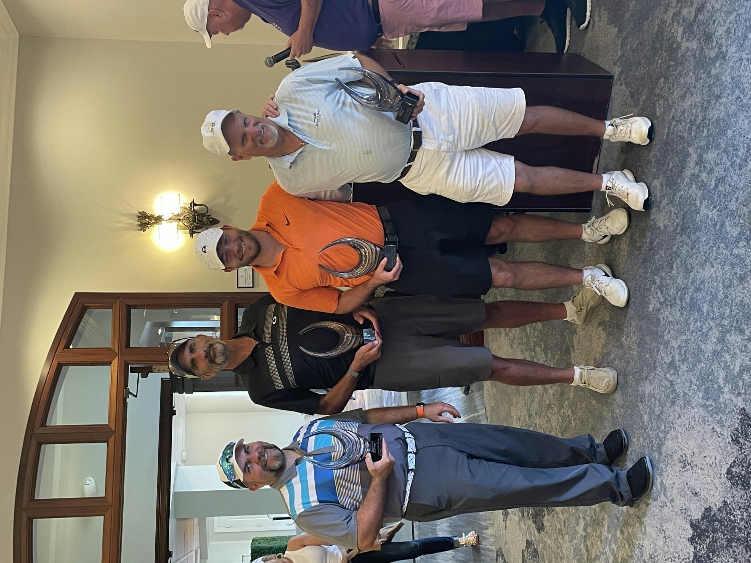  2023 Annual Hadinger Flooring Golf Tournament our team accepting their second place trophy's.