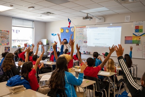 Here we see a teacher keeping the students engaged in the classroom!