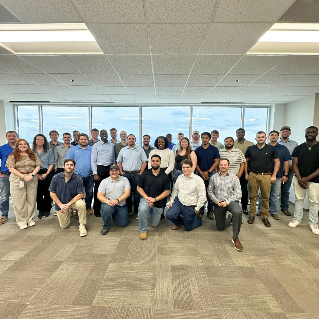Graduates of the CMC Core Program celebrate the completion of the rotational development program.