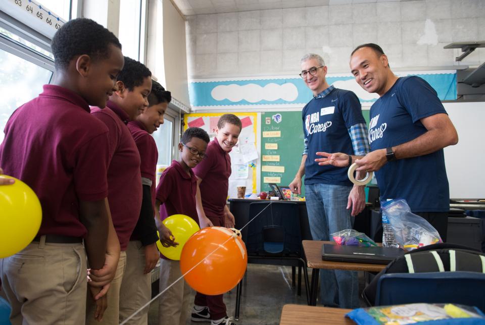 Deputy Commissioner Mark Tatum and NBA Cares give back