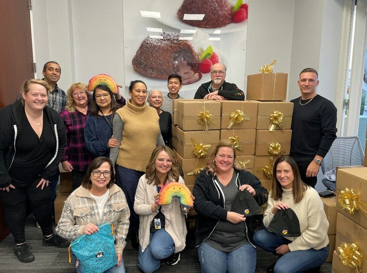 Our Pride ERG volunteers show support to the Lavender Seniors by assembling care packages.