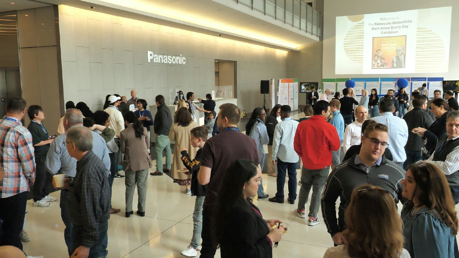 Panasonic employees attending an exhibition event featuring the Panasonic founder Konosuke Matsushita
