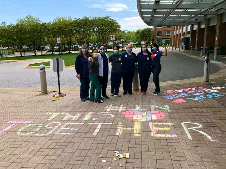 Associates celebrate together out front of Mary Washington Hospital