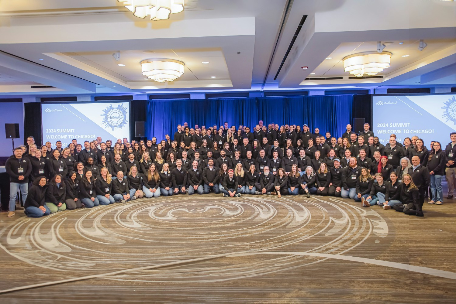 Taking a break from learning at the 2023 Goodie Summit, the team comes together for a group photo.  