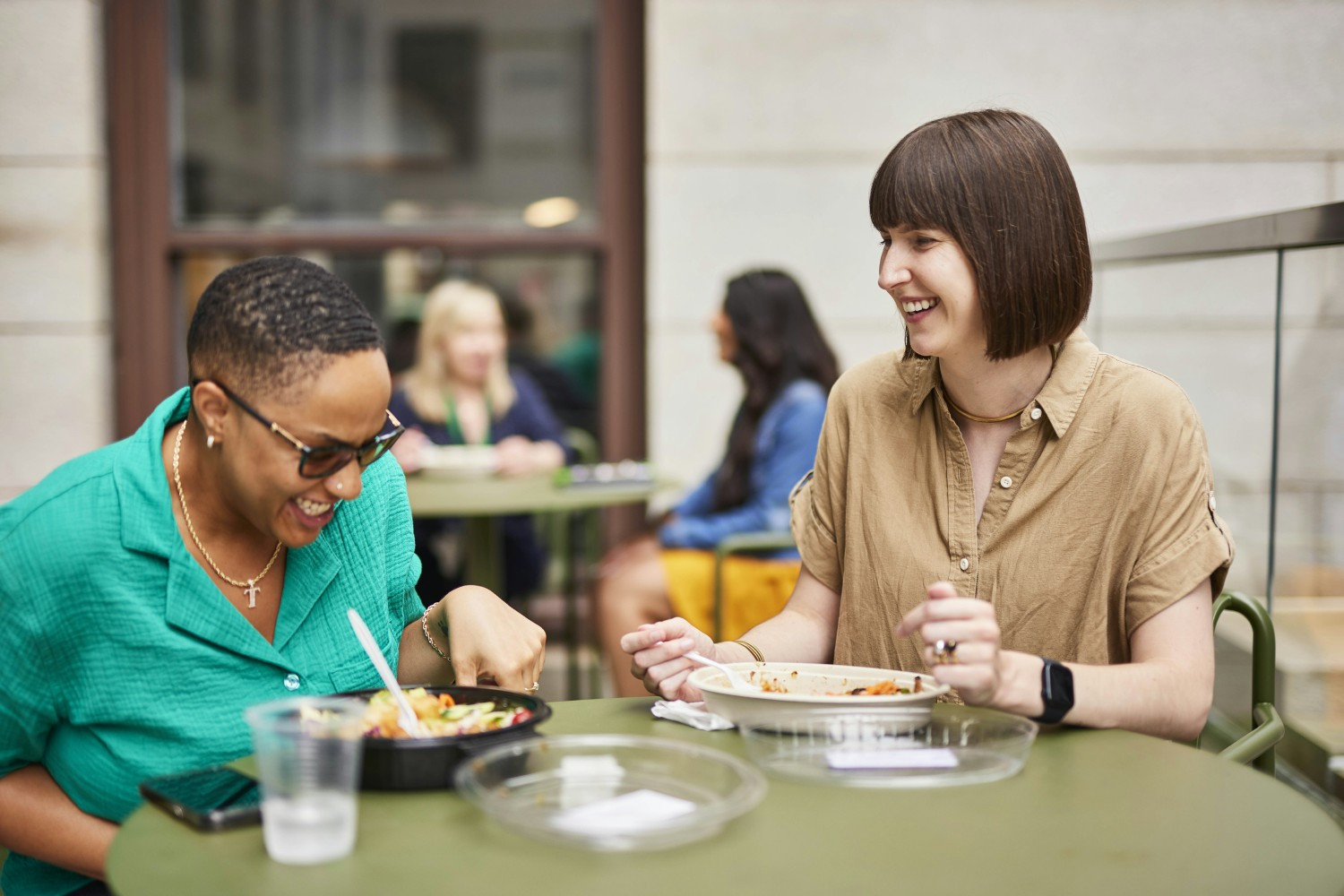 Employees take advantage of ezCater's meal subsidy to order lunch and share a meal outdoors at the Boston office. 
