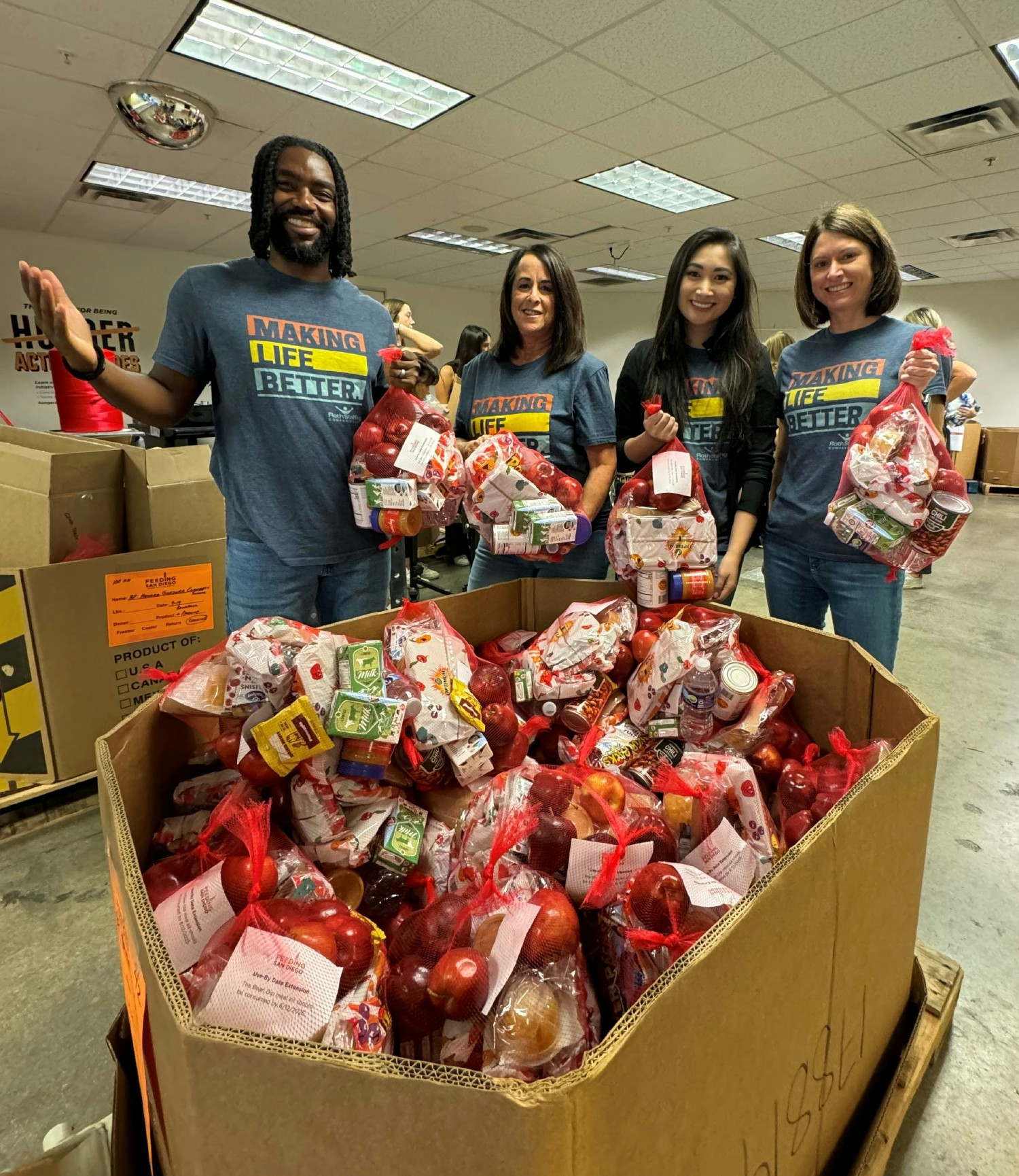 Our team is proud to help organize food at local pantries and support those in need.