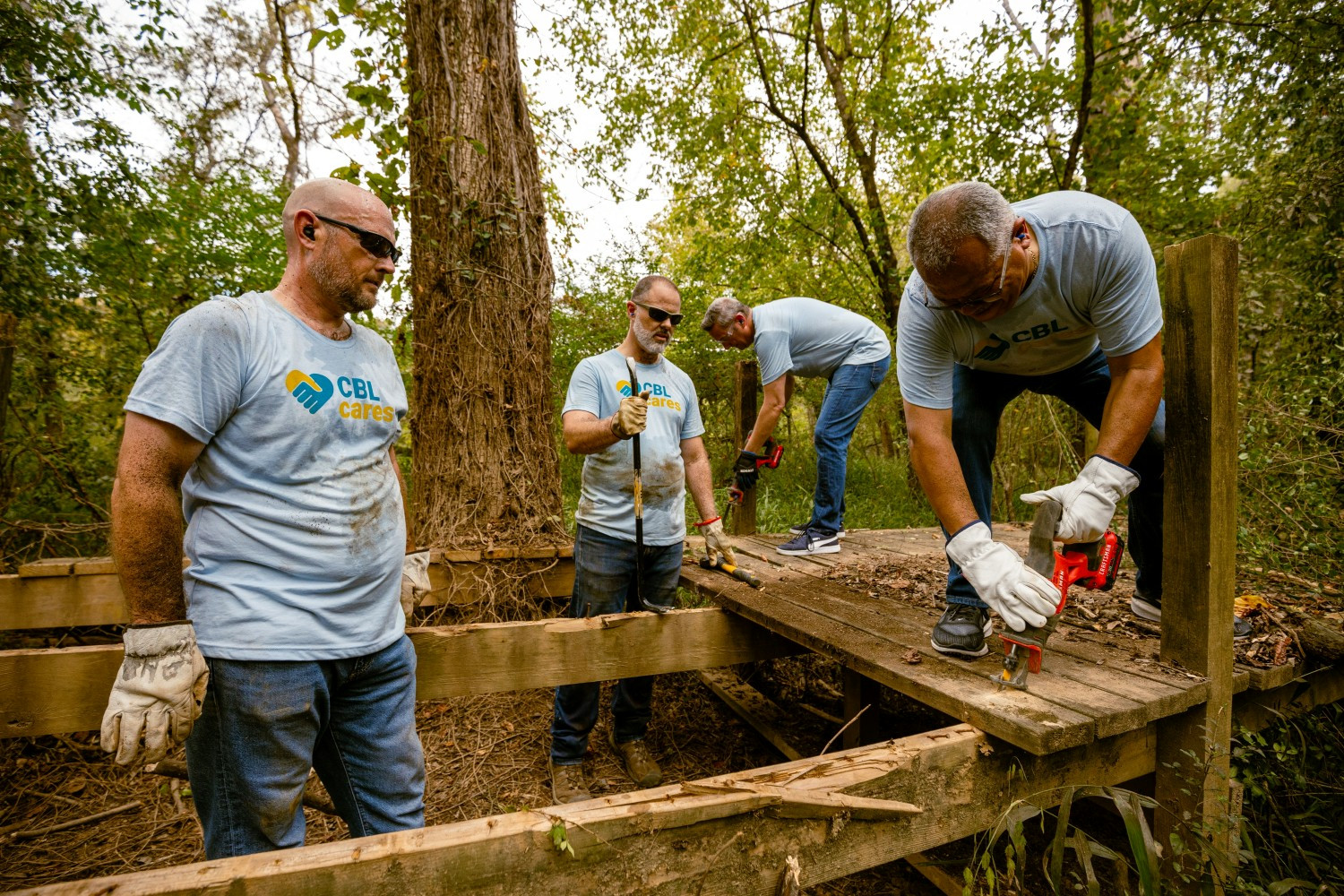 CBL Cares hard at work volunteering at Reflection Riding Center