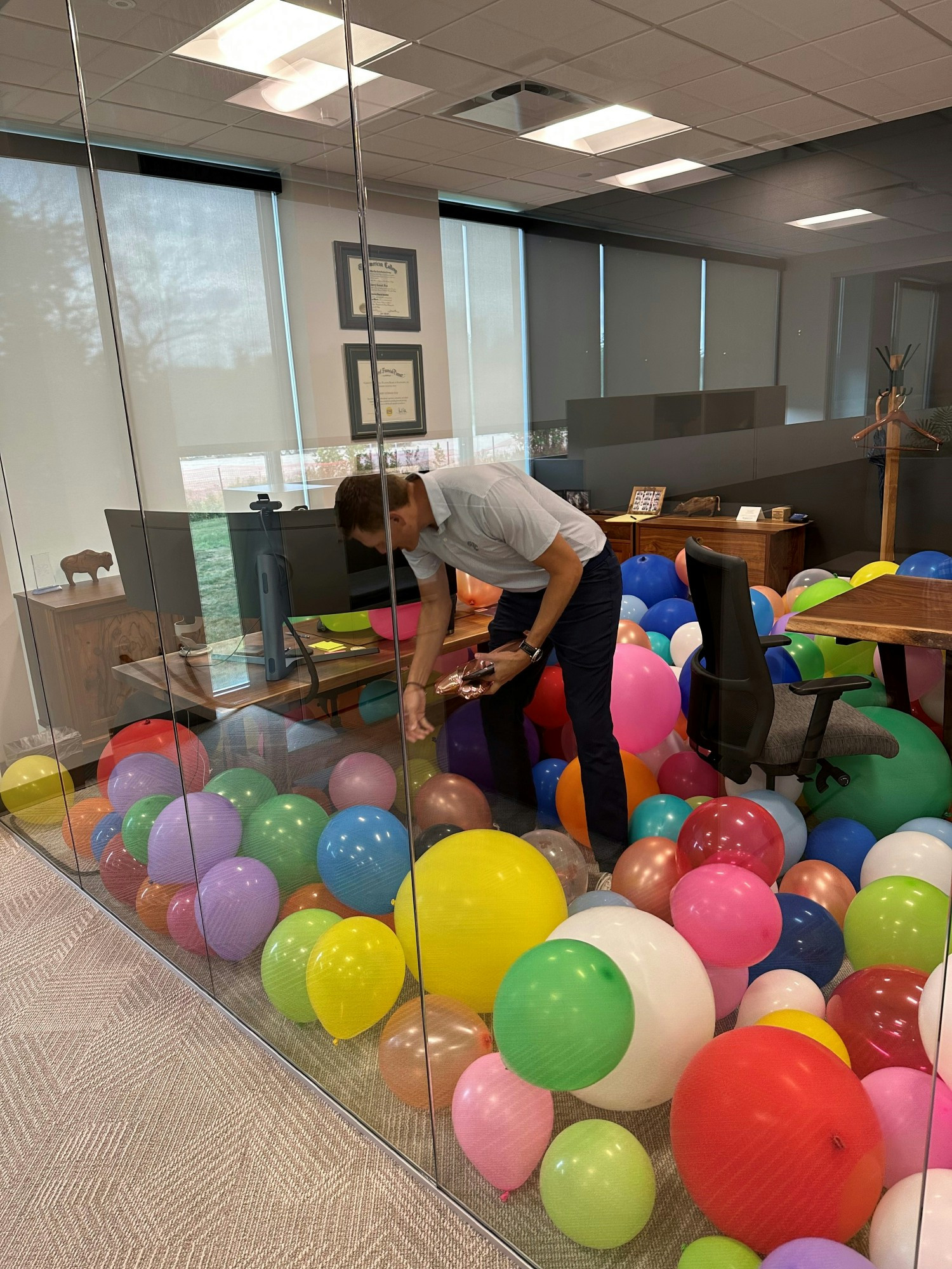 Practical jokes are common at our workplace - Barry LOVES balloons, so we thought - why not? 
