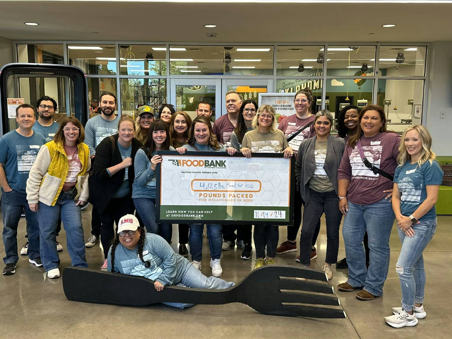 A day of service and smiles. The Persimmon Group team packaged 4,125 pounds of food at Food Bank of Eastern Oklahoma.