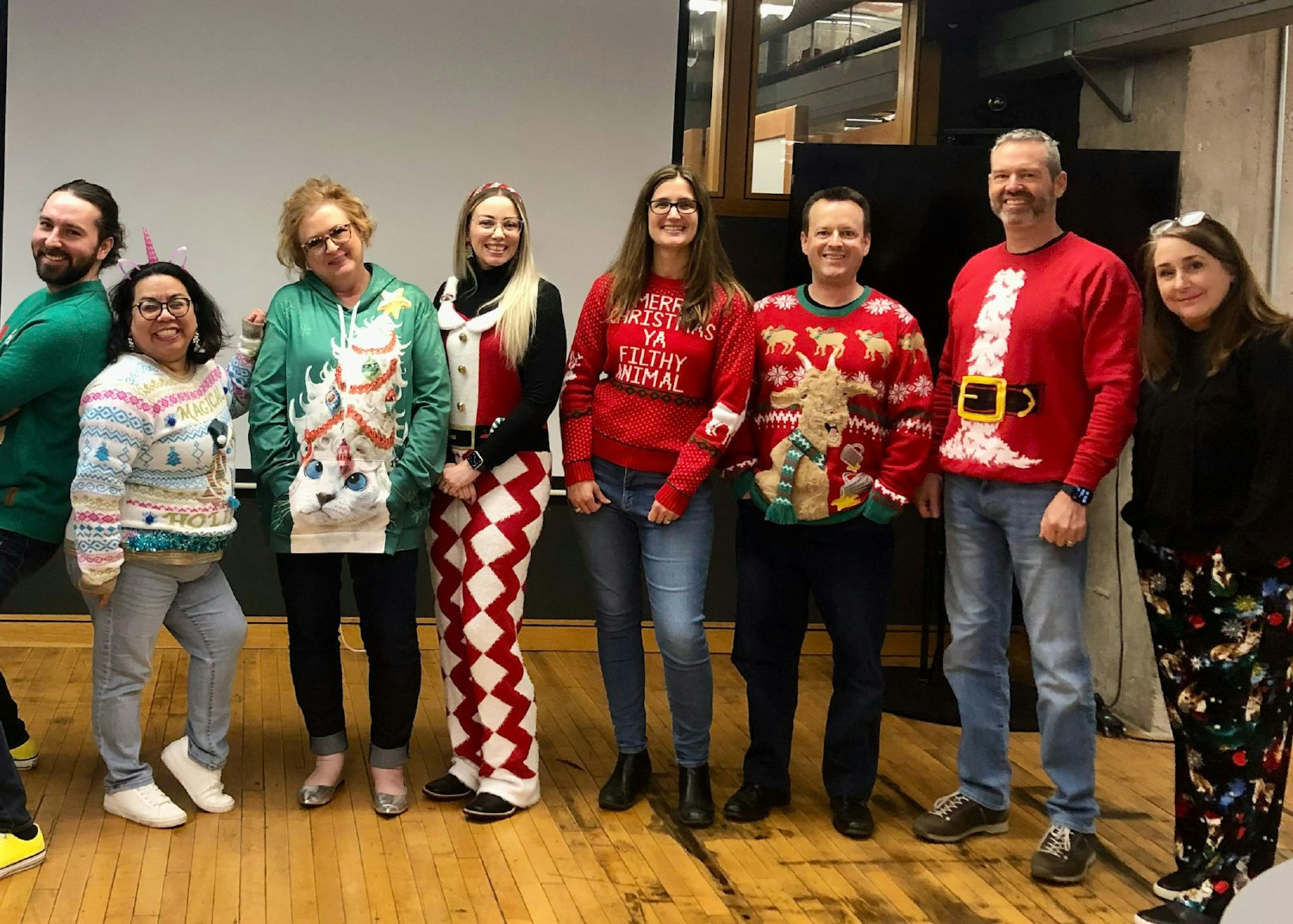 A snapshot of camaraderie and the commitment to making TPG great, one ugly sweater and one successful project at a time