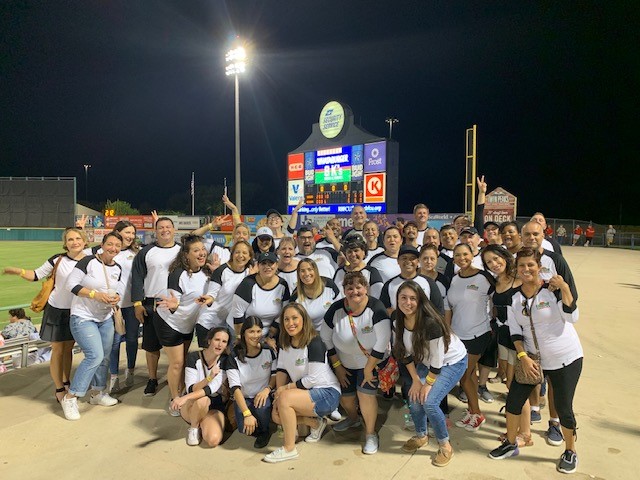 Each year we host a baseball event where our Associates receive a baseball tee with their seniority number on the back. 