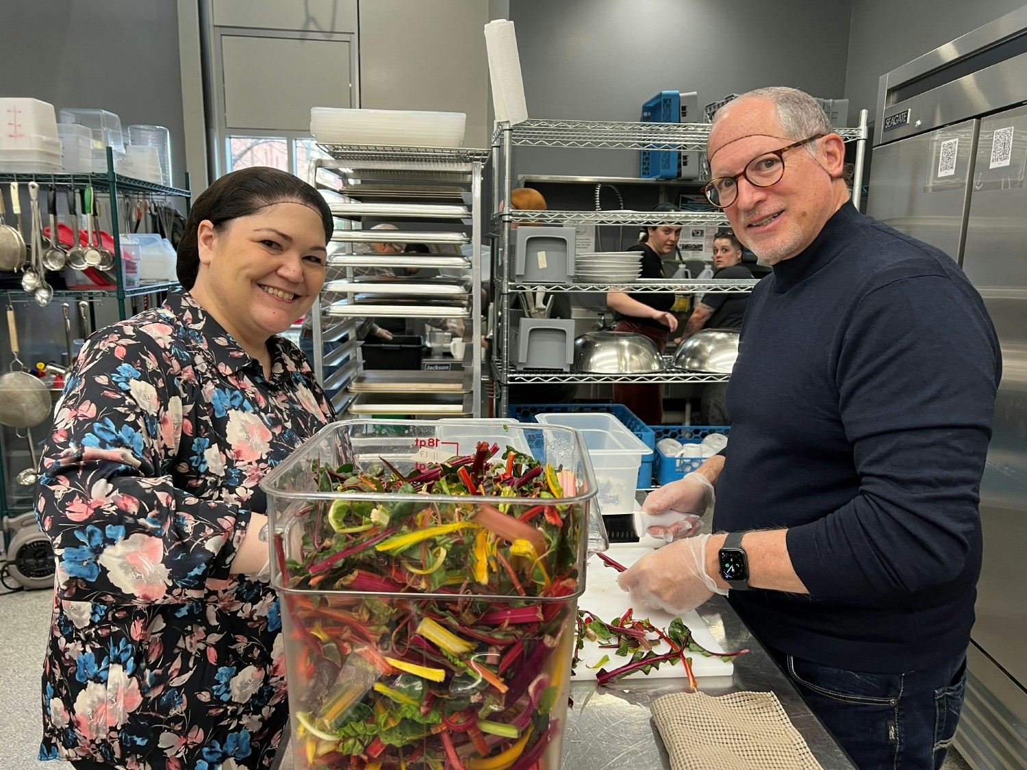 SSOE’s CEO and employee volunteer at downtown Toledo’s SAME Café, a donation-based, fair exchange nonprofit restaurant.