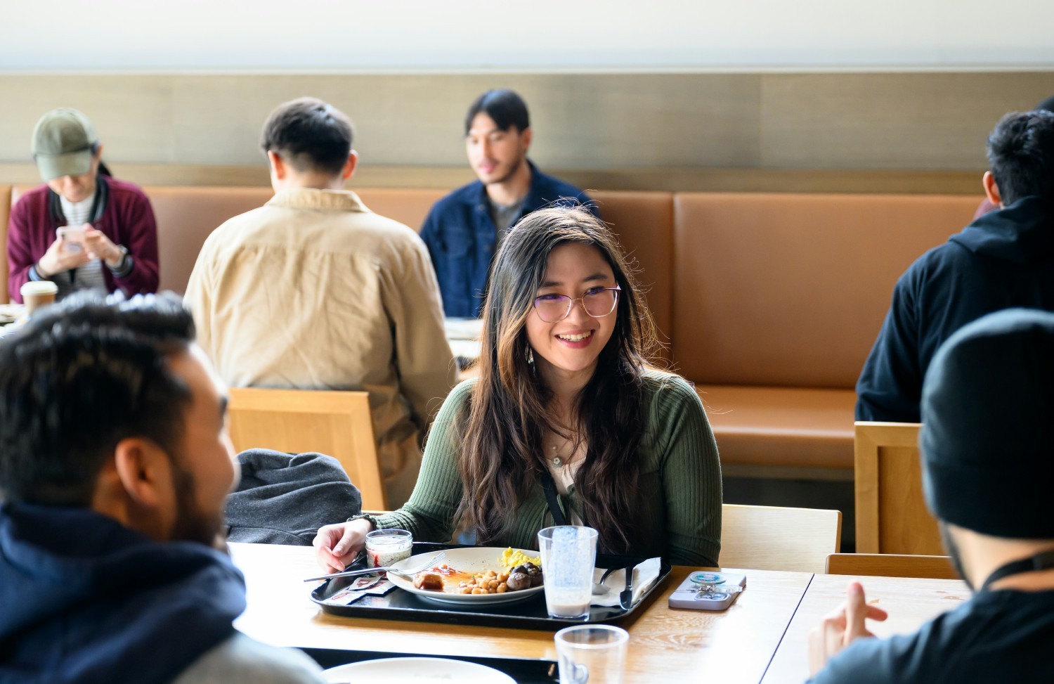 Colleagues eating lunch in the cafe at AppLovin's Headquarters