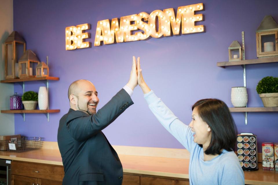 Highfive CRO Bobby Marhamat and CFO Celia Poon share a highfive after joining the team in early 2018