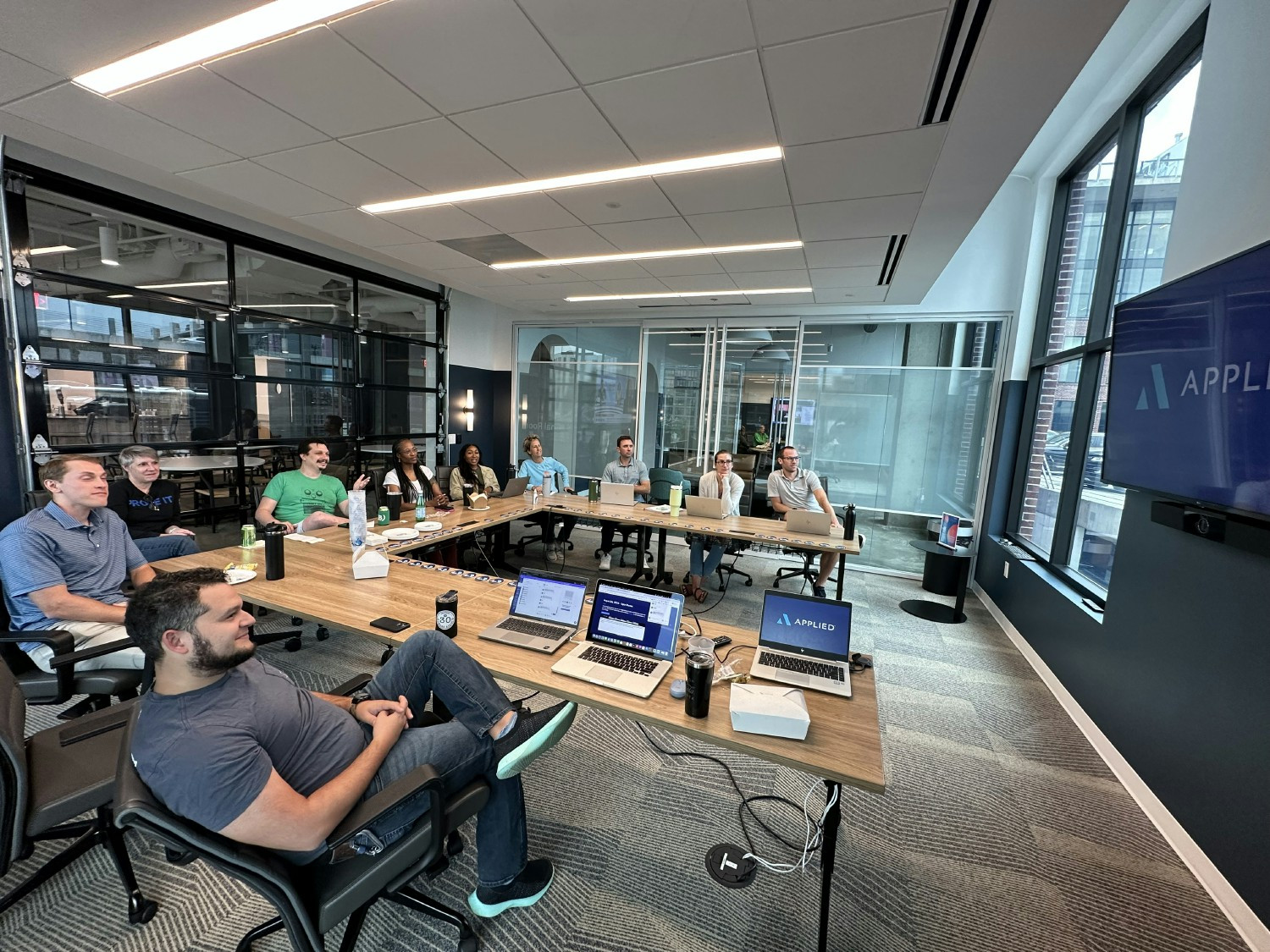 Members of Team Applied gather together in our Atlanta office