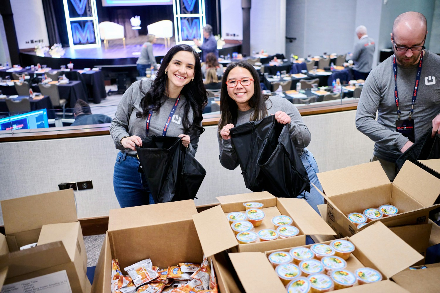 JVM Team packing food to donate to children's charity.