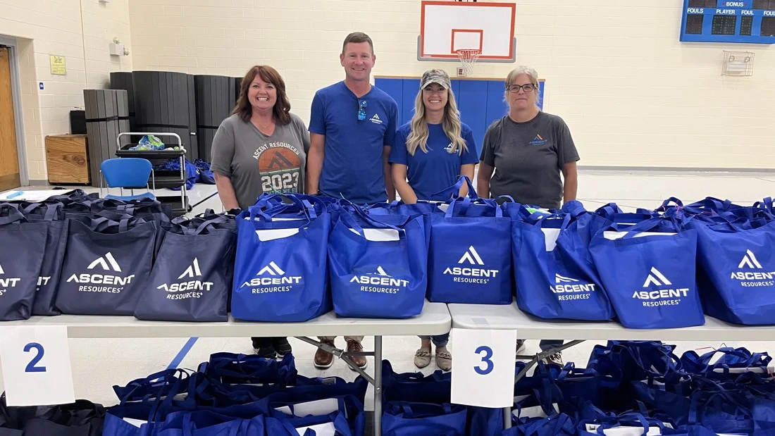 Employees stuffed 450 bags with school supplies for the Annual Pack the Backpack campaign supporting a local school.
