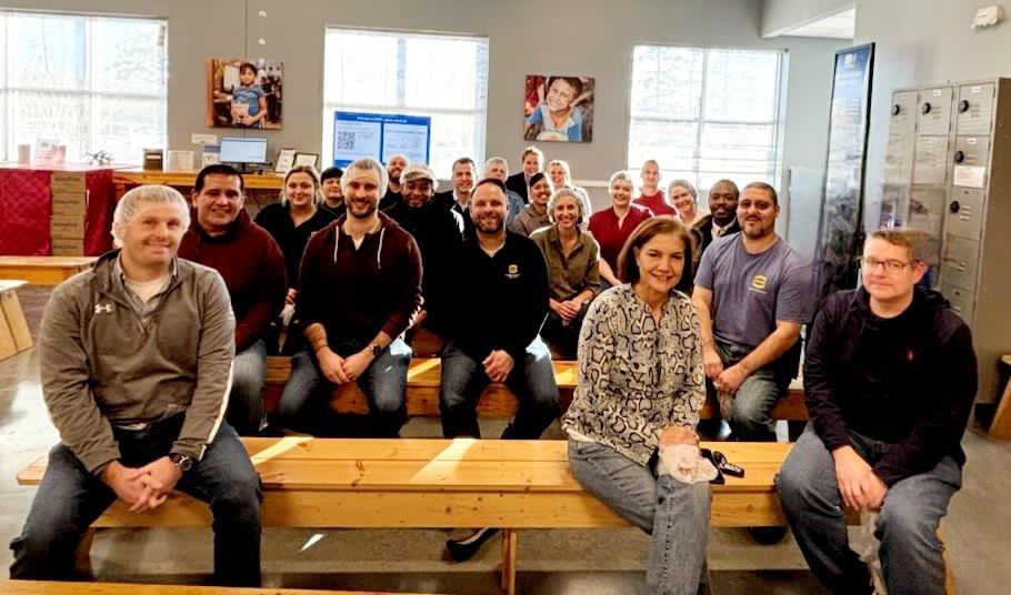 A group of our team members volunteering at Feed My Starving Children! All employees have 8 paid hours of volunteer time