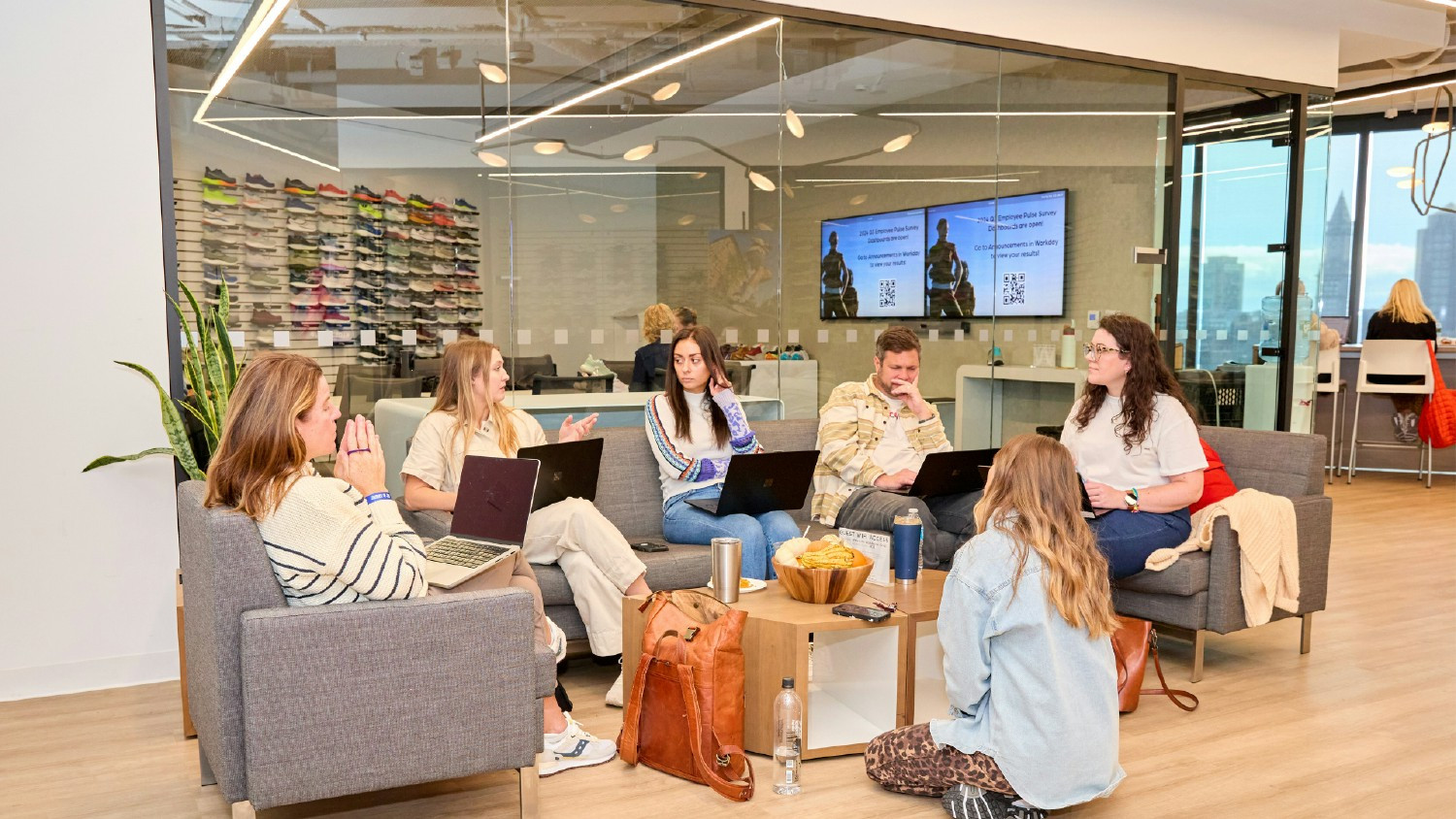 Teamwork and laughter in action, as WWW employees brainstorm and collaborate to deliver industry-leading footwear.