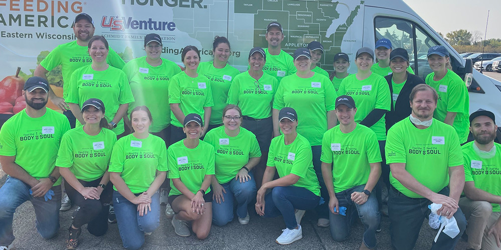 Team members at the Feed the Body, Feed the Soul volunteering event